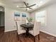 Cozy dining area with a dark wood table, comfortable chairs, and ample natural light at 445 Short Hills Dr, Charlotte, NC 28217