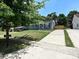 Charming home with landscaped front yard, long driveway, and inviting curb appeal at 445 Short Hills Dr, Charlotte, NC 28217