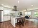 Bright, open kitchen with granite countertops, stainless steel appliances, and views of the living area at 445 Short Hills Dr, Charlotte, NC 28217