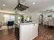 Stylish kitchen with granite island, stainless appliances, and open layout to living and dining areas at 445 Short Hills Dr, Charlotte, NC 28217
