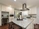 Modern kitchen features white cabinets, granite countertops, breakfast bar, and stainless steel appliances at 445 Short Hills Dr, Charlotte, NC 28217