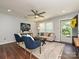 Cozy living room with neutral decor, ceiling fan, and comfortable seating arrangement at 445 Short Hills Dr, Charlotte, NC 28217