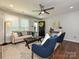 Inviting living room with natural light, a ceiling fan, and stylish furnishings at 445 Short Hills Dr, Charlotte, NC 28217