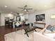 Well-lit living room featuring hardwood floors, stylish furniture, and a view into the kitchen at 445 Short Hills Dr, Charlotte, NC 28217
