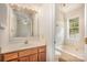 A bathroom featuring a white tub, toilet, vanity, and sink at 5301 Amity Springs Dr, Charlotte, NC 28212