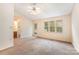 Spacious bedroom with plush carpeting, ample natural light, and ceiling fan at 5301 Amity Springs Dr, Charlotte, NC 28212