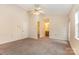 Bedroom featuring neutral carpet, walk-in closet and bathroom access at 5301 Amity Springs Dr, Charlotte, NC 28212