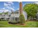 Charming townhome with a screened porch, upper deck, and lush green lawn at 5301 Amity Springs Dr, Charlotte, NC 28212
