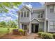 Charming two-story townhome with light gray siding and manicured landscaping provides a welcoming curb appeal at 5301 Amity Springs Dr, Charlotte, NC 28212