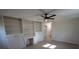 Bright living room features built in shelves, storage, and ceiling fan at 544 Stoneybrook Rd, Statesville, NC 28677