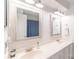 Double vanity bathroom with two large mirrors and bright lighting at 5700 Carmel Station Ave, Charlotte, NC 28226