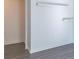 Modern bedroom with gray laminate floors, a closet and neutral walls at 5700 Carmel Station Ave, Charlotte, NC 28226