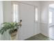 Bright foyer with a white front door, side-lights and tiled flooring at 5700 Carmel Station Ave, Charlotte, NC 28226