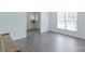 Bright living room with hard wood floors and a view into the foyer at 5700 Carmel Station Ave, Charlotte, NC 28226