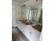 Elegant bathroom with double sinks, quartz countertops and a large mirror at 5947 Tipperary Dr, Denver, NC 28037