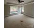 Primary bedroom with a large window seat, providing ample natural light at 5947 Tipperary Dr, Denver, NC 28037
