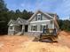 Charming home featuring stone accents, shingle siding, and a well-manicured lawn at 5947 Tipperary Dr, Denver, NC 28037