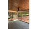 Relaxing screened porch with a ceiling fan and wooded views at 5947 Tipperary Dr, Denver, NC 28037