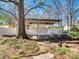 Covered backyard patio area with ceiling fans and seating for outdoor entertaining at 601 Wilmar Nw St, Concord, NC 28025