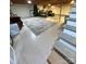 An unfinished basement area showcasing cement floor, open ceilings, stairs, and lots of room for storage at 601 Wilmar Nw St, Concord, NC 28025