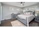 The bedroom features a ceiling fan, hardwood floors, and bright windows, creating a relaxing and inviting space at 601 Wilmar Nw St, Concord, NC 28025
