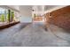 View of a carport and fenced deck area featuring an open space to park and entertain outdoors at 601 Wilmar Nw St, Concord, NC 28025