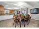This dining area features a wooden table, seating for eight, and an adjacent kitchen, perfect for Gathering gatherings at 601 Wilmar Nw St, Concord, NC 28025