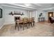 The dining area showcases a fireplace and connects to a kitchen and living area, offering a seamless flow at 601 Wilmar Nw St, Concord, NC 28025