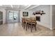 Charming dining area with fireplace and sliding glass doors leading to outdoor patio at 601 Wilmar Nw St, Concord, NC 28025