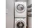 Conveniently stacked washer and dryer, complete with shelving for efficient laundry solutions at 601 Wilmar Nw St, Concord, NC 28025