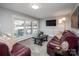 Cozy living room with an abundance of natural light, a large window and hardwood flooring at 601 Wilmar Nw St, Concord, NC 28025