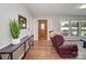 Inviting foyer with a wooden front door and views into the sunny living space at 601 Wilmar Nw St, Concord, NC 28025