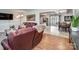 Open-concept living space featuring hardwood floors and bright natural light with views into the kitchen at 601 Wilmar Nw St, Concord, NC 28025