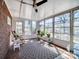 Charming sunroom with an abundance of natural light, tile flooring, ceiling fan, and views of the backyard at 601 Wilmar Nw St, Concord, NC 28025
