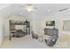 Spacious bedroom with a loft bed, sitting area, and a large dresser with TV at 7295 Three Sisters Ln, Concord, NC 28027