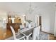 Bright dining room with chandelier adjacent to gourmet kitchen area at 7295 Three Sisters Ln, Concord, NC 28027