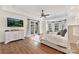 Luxurious main bedroom with ample light, TV, and hardwood flooring at 7295 Three Sisters Ln, Concord, NC 28027