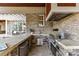 Outdoor kitchen features a built-in grill, bar seating, and ample counter space for cooking at 7295 Three Sisters Ln, Concord, NC 28027