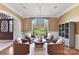 Cozy sitting area with garden view, neutral decor, and stylish chandelier at 7295 Three Sisters Ln, Concord, NC 28027