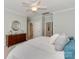 Bedroom with a dresser and decorative mirror adding to the room's charm at 8015 Greenview Terrace Ct, Charlotte, NC 28277