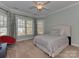 Bedroom with big bright windows and stylish curtains at 8015 Greenview Terrace Ct, Charlotte, NC 28277