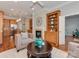 Inviting living room features a fireplace, built-in bookshelves, and seamless flow to the kitchen at 8015 Greenview Terrace Ct, Charlotte, NC 28277
