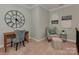 Cozy office space featuring a work desk, accent chair, and minimalist decor at 8015 Greenview Terrace Ct, Charlotte, NC 28277