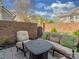 This brick patio has comfortable seating, a fire pit and a brick privacy wall at 8015 Greenview Terrace Ct, Charlotte, NC 28277