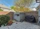 This brick patio has extra storage, lush greenery, and is a cozy outdoor space at 8015 Greenview Terrace Ct, Charlotte, NC 28277