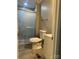 Bathroom featuring a tiled shower with glass doors, toilet, and vanity with storage at 8502 Simpson Rd, Waxhaw, NC 28173