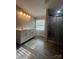 Bathroom featuring double sink vanity, walk-in shower and tiled floors at 8502 Simpson Rd, Waxhaw, NC 28173