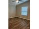 Bedroom with wood-look flooring, window with blinds, and a ceiling fan with light at 8502 Simpson Rd, Waxhaw, NC 28173