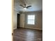 Bedroom featuring a ceiling fan, a window with blinds, and wood-look flooring at 8502 Simpson Rd, Waxhaw, NC 28173
