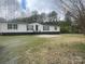 Inviting single-story home featuring classic design elements and a spacious front yard at 8502 Simpson Rd, Waxhaw, NC 28173
